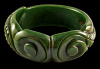 vintage scroll and leaf carved green bakelite bangle